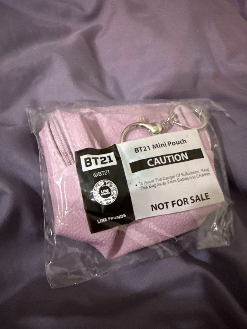 Mini pouch (Category: Purses & Pouches) located in Singapore. Submitted by choyphin (Listing ID 1453770932, Image 2). Description: - Adorable pink mini pouch - Features a cute BT21 character design - Comes with a keychain loop for easy attachment - Ideal for storing coins, cards, or small personal items.