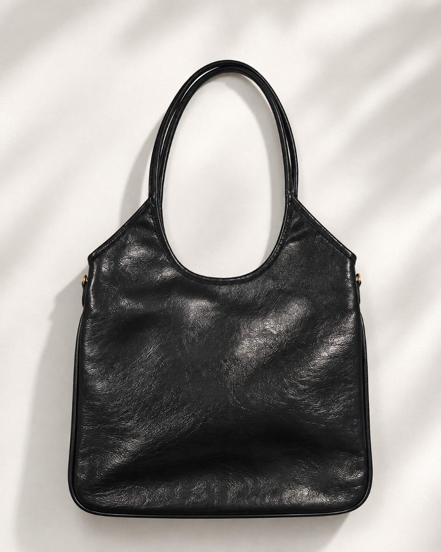 Miu Miu Ivy Tote bag (Category: Luxury Bags & Wallets) located in Pateros City. Submitted by hoarderhub (Listing ID 1453803473, Image 2). Description: Miu Miu Ivy Tote bag Black Patent leather with black canvas lining and gold hardware My favorite work bag. Used only around 5x. It's understated, timeless, and very classy. ✨ Please make an offer. Once accepted, I'll share my complete pickup details (name, address, and contact number) for your peac