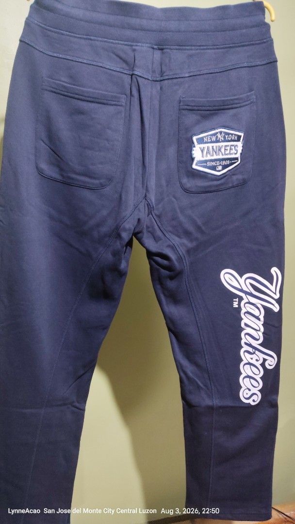 MLB New York Yankees Patched Sweatpants Size 32 (Category: Joggers) located in Manila. Submitted by rhobin.m08 (Listing ID 1453622749, Image 2). Description: - Navy blue sweatpants - Size 32 - All-over New York Yankees patches - Yankees logo on back pocket - 'Yankees' script down the leg - Comfortable cotton blend fabric - Ideal for casual wear and showing team spirit.