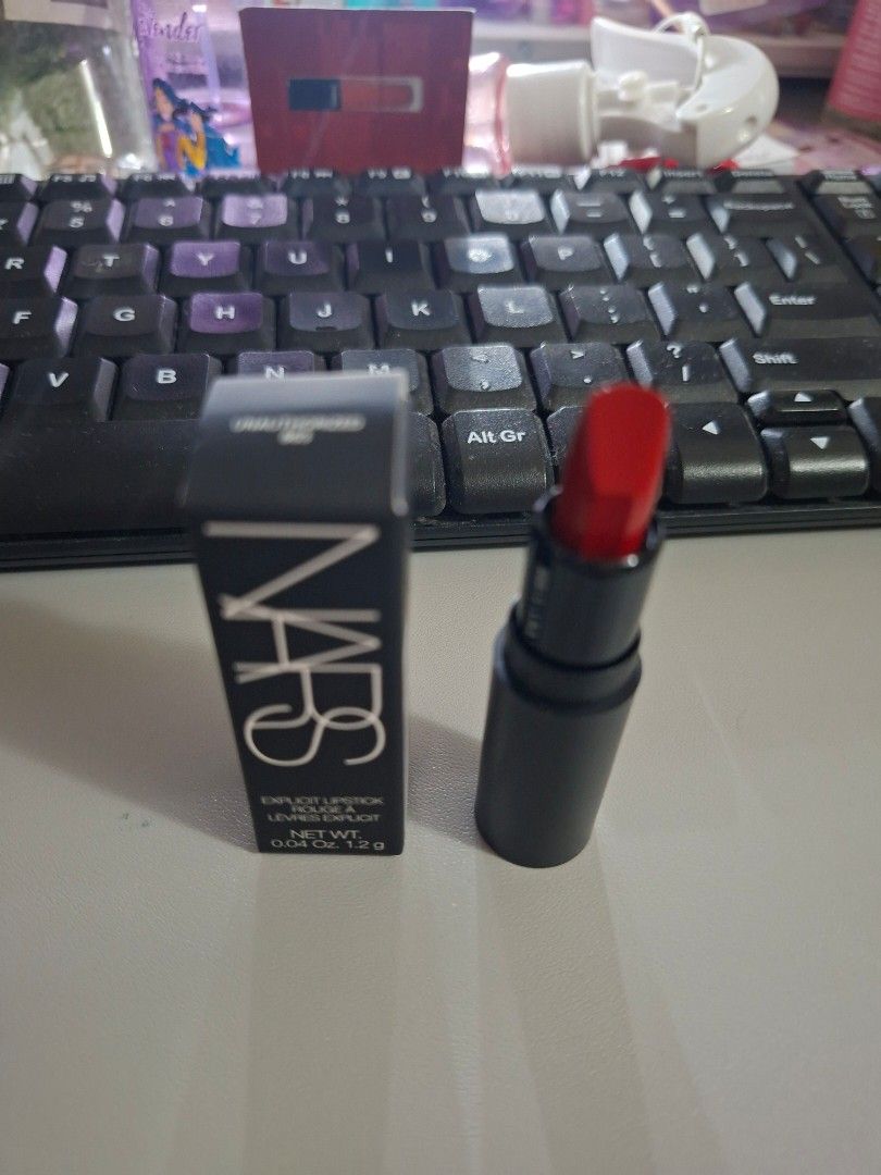 NARS Explicit Lipstick 863 Unauthorized Classic Red (Category: Makeup) located in Manila. Submitted by yanakolekzione (Listing ID 1453672538, Image 1). Description: - NARS Explicit Lipstick mini (1.2g) - Shade: 863 Unauthorized Classic Red (Bold, classic red) - Condition: Brand new, original packaging - Perfect for adding a pop of color - A must-have for your makeup collection.