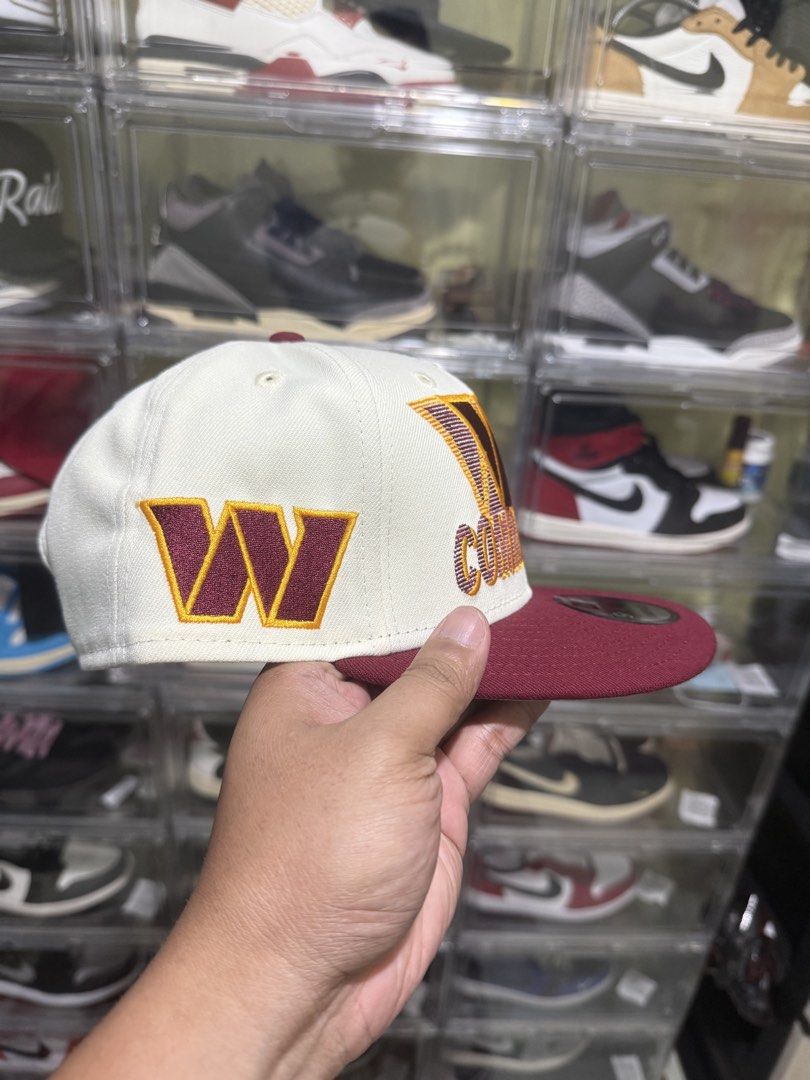 New Era 9FIFTY Washington Commanders Snapback Hat (Category: Caps & Hats) located in Manila. Submitted by batoy8814895 (Listing ID 1453640878, Image 2). Description: - Washington Commanders New Era 9FIFTY snapback hat - Cream crown with maroon brim and details - Features the Commanders logo embroidered on the front - Adjustable snapback closure for a custom fit - Ideal for any dedicated fan - Taguig location.