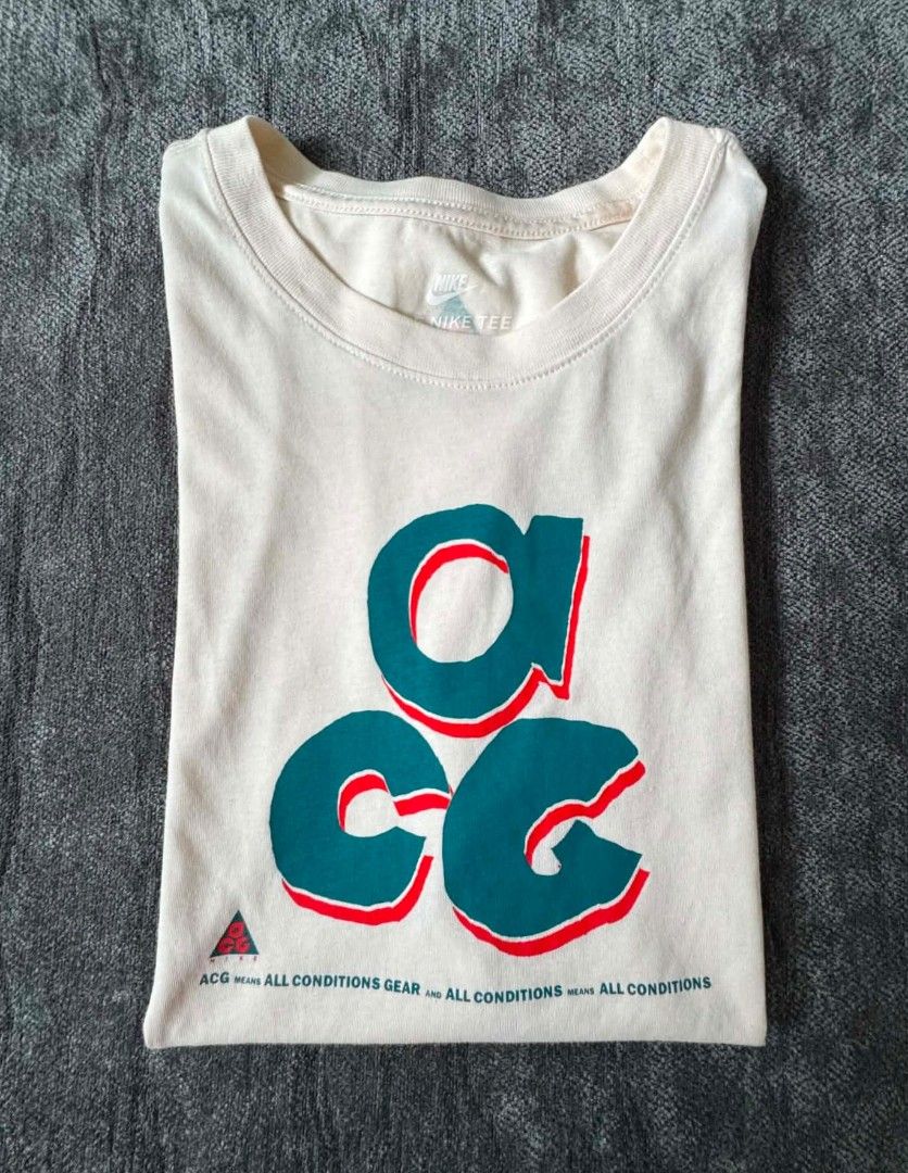 Nike ACG T-Shirt Cream (Category: Tshirts & Polo Shirts ) located in Caloocan City. Submitted by jpygoodies (Listing ID 1453703084, Image 3). Description: - Cream colored Nike ACG t-shirt - Features the iconic ACG logo graphic on the front - Small ACG logo detail on the back - "All Conditions Gear" (ACG) collection - Comfortable and versatile for everyday wear.