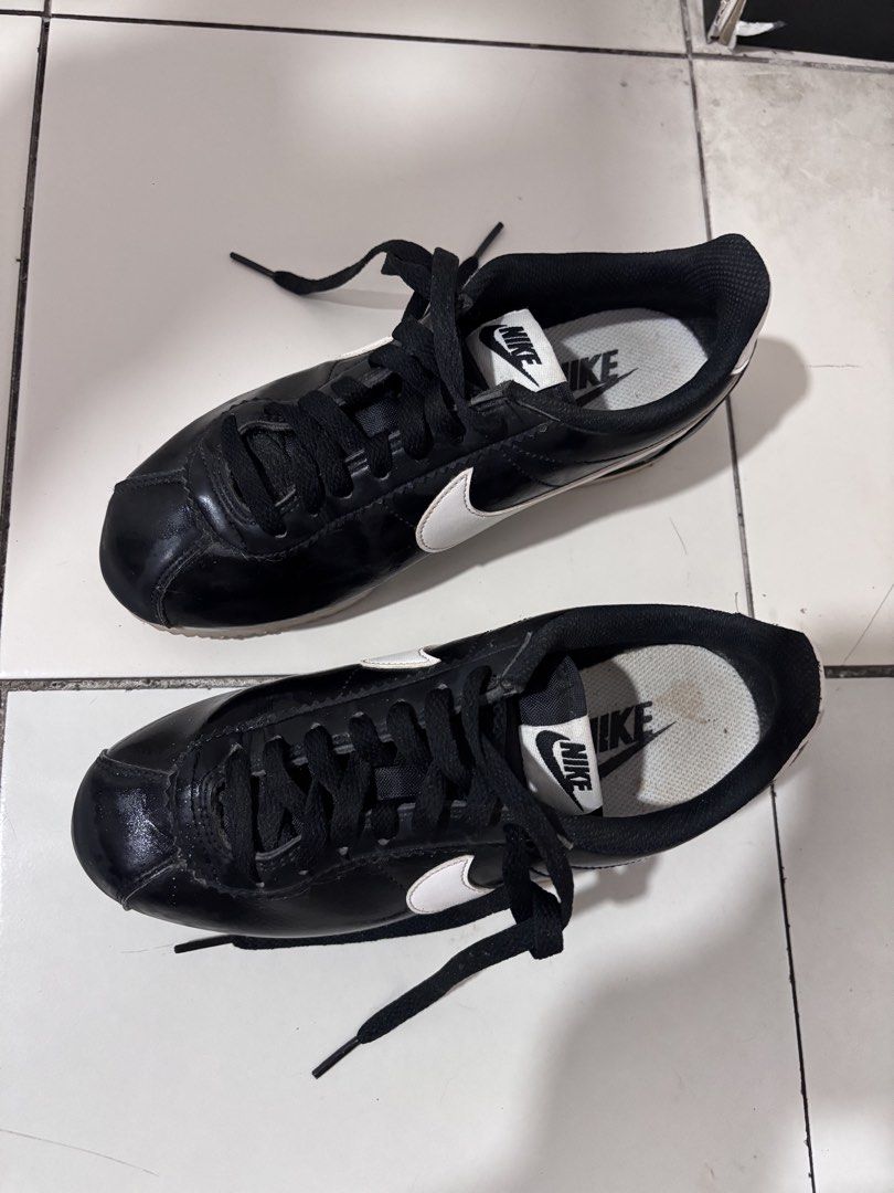 Nike Cortez Black White Leather Sneakers (Category: Sneakers) located in Quezon City. Submitted by makeitkmn (Listing ID 1453751863, Image 2). Description: - Classic Nike Cortez sneakers - Black leather upper with white Nike swoosh - Black laces - White soles - Ideal for everyday wear.