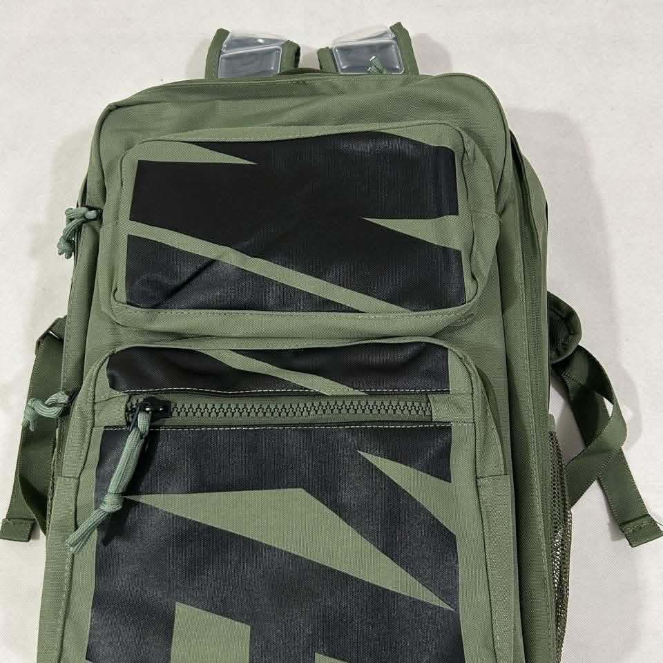 Nike Utility Backpack Green (Category: Backpacks) located in Cavite. Submitted by moo2k (Listing ID 1453685465, Image 1). Description: - Green Nike Utility Backpack - Multiple front pockets for easy access - Wide-opening main compartment for ample storage - Side mesh pockets for water bottles or essentials - Padded straps for comfortable carrying - Ideal for everyday use, school, or travel.