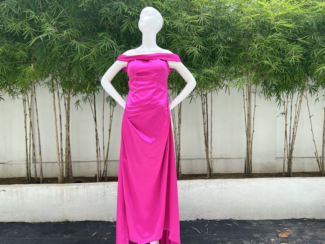 Off-shoulder Fuchsia Ruched Maxi Dress (Category: Dresses) located in Quezon City. Submitted by amandasee21 (Listing ID 1453785257, Image 2). Description: - Vibrant fuchsia off-shoulder maxi dress - Flattering side ruching detail - Fabric with a lovely sheen - Ideal for parties or formal events - Guaranteed to make a statement.