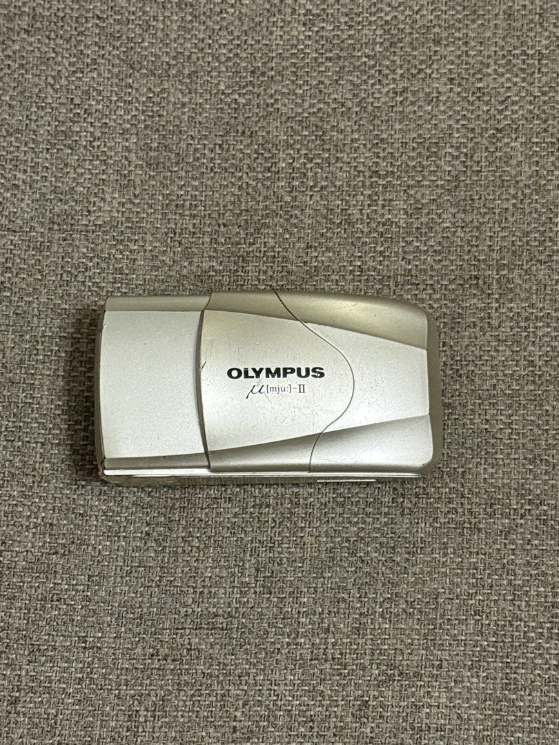 Olympus mju-II Film Camera (Category: Cameras) located in Victorias. Submitted by glxnny.g (Listing ID 1453764374, Image 1). Description: - Olympus mju-II point and shoot camera - 35mm f/2.8 lens - Film tested - Compact and user-friendly design - Perfect for casual photography - Lens is clear - Flash working Flaws: - LCD bleeding - Battery door needs to be taped - Scratches on the body - Light leaks when using flash.