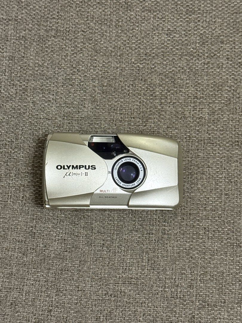 Olympus mju-II Film Camera (Category: Cameras) located in Victorias. Submitted by glxnny.g (Listing ID 1453764374, Image 2). Description: - Olympus mju-II point and shoot camera - 35mm f/2.8 lens - Film tested - Compact and user-friendly design - Perfect for casual photography - Lens is clear - Flash working Flaws: - LCD bleeding - Battery door needs to be taped - Scratches on the body - Light leaks when using flash.
