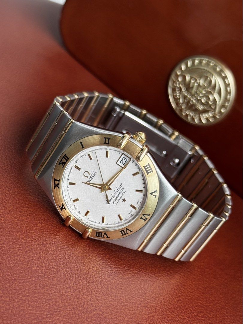 Omega Constellation Chronometer Automatic White Dial (Category: Luxury Watches) located in Quezon City. Submitted by mjgorobat15 (Listing ID 1453634734, Image 2). Description: Omega Constellation Chronometer Automatic White Dial •Reference no. 1202.30 •Year 2007s •Dial: Silver-white textured waffle/guilloché pattern •Movement: Omega Caliber 1120 Automatic •Case: Brushed stainless steel case with an 18K yellow gold bezel and gold accented "claws" 