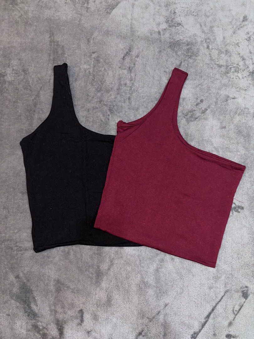 One Shoulder Crop Tops (Black & Burgundy) (Category: Others Tops) located in Manila. Submitted by _closetcleanup (Listing ID 1453776052, Image 2). Description: - Set of 2 one-shoulder crop tops - Colors: Black and Deep Burgundy - Material: Stretchy and comfortable - Versatile: Great for layering or wearing solo - Fit: Stretchy fabric accommodates most sizes.