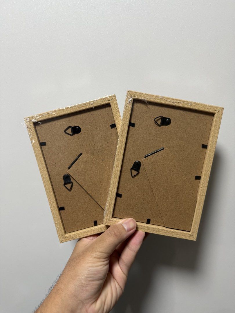 Picture Frames (Category: Frames & Pictures) located in Singapore. Submitted by thebiggest (Listing ID 1453812838, Image 2). Description: - Brand new -Set of 2 wooden photo frames - Light wood color - Versatile display: can be hung or stood up - Perfect for showcasing your favorite memories Bought wrong size thus selling Meet up at my convenience which is in Hougang .