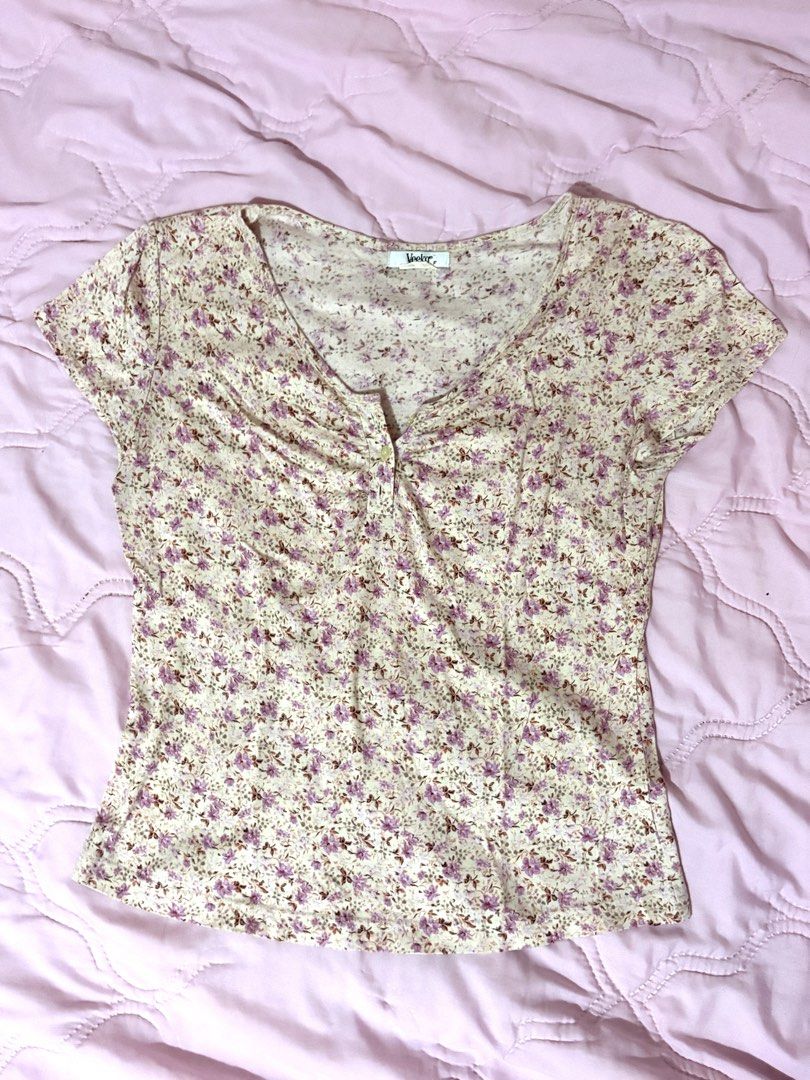 Pink Floral Print Button Up Top (Category: Blouses) located in Antipolo. Submitted by ursellula (Listing ID 1453605774, Image 1). Description: - Cute floral print top from Veeko - Light and airy fabric - Short sleeves with a slight puff - Button detail at the neckline - Versatile for casual or slightly dressy occasions - Comfortable and well-fitting.