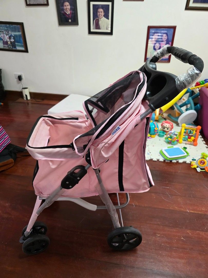 Pink Pet Stroller for Small Dogs or Cats (Category: Homes & Other Pet Accessories) located in Paranaque City. Submitted by isalinatoc (Listing ID 1453810634, Image 3). Description: - Lightweight pink pet stroller - Mesh windows for excellent ventilation - Easy to maneuver with 360 swivel wheels - Folds down compactly for convenient storage - Ideal for taking your furry friend on adventures - Note: Minor marks on interior fabric - Handlebar still 