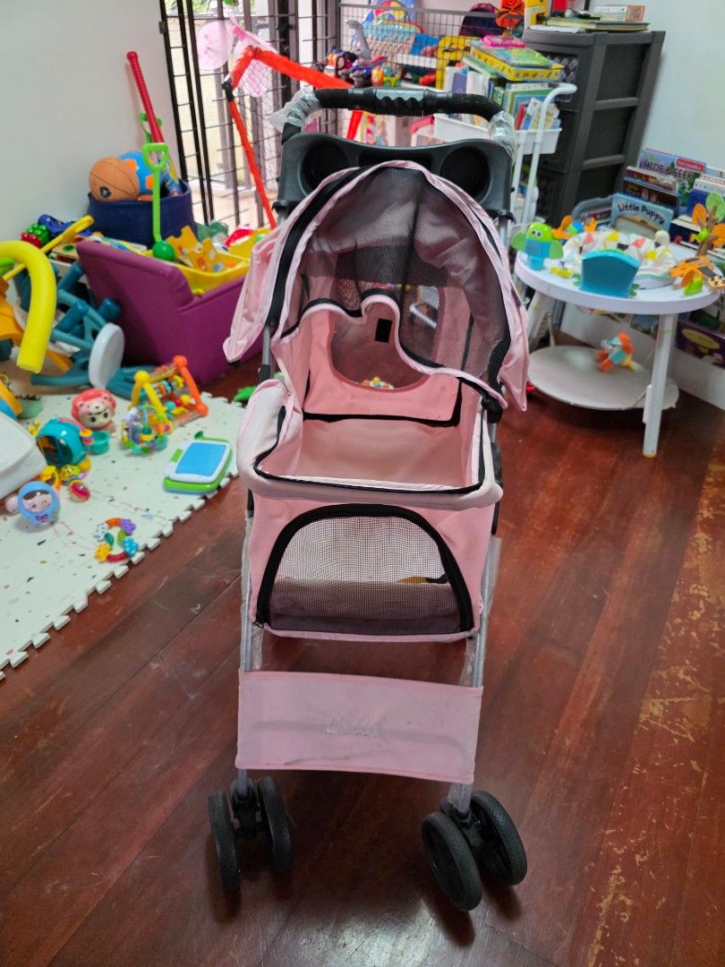 Pink Pet Stroller for Small Dogs or Cats (Category: Homes & Other Pet Accessories) located in Paranaque City. Submitted by isalinatoc (Listing ID 1453810634, Image 2). Description: - Lightweight pink pet stroller - Mesh windows for excellent ventilation - Easy to maneuver with 360 swivel wheels - Folds down compactly for convenient storage - Ideal for taking your furry friend on adventures - Note: Minor marks on interior fabric - Handlebar still 