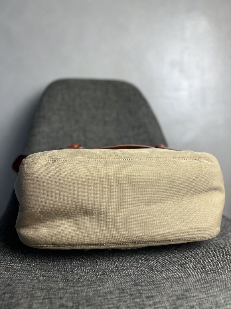 Porter Yoshida & Co x Nikon - 2 Way Camera Shoulder Bag (Category: Camera Bags & Carriers) located in Quezon City. Submitted by cityboycrates_ph (Listing ID 1453747639, Image 3). Description: Selling a functional shoulder bag from the partnership between Nikon and PORTER (Yoshida & Co.). This piece features a durable tan canvas exterior paired with brown leather accents and branded hardware. The bag is designed with a messenger-style flap and sec