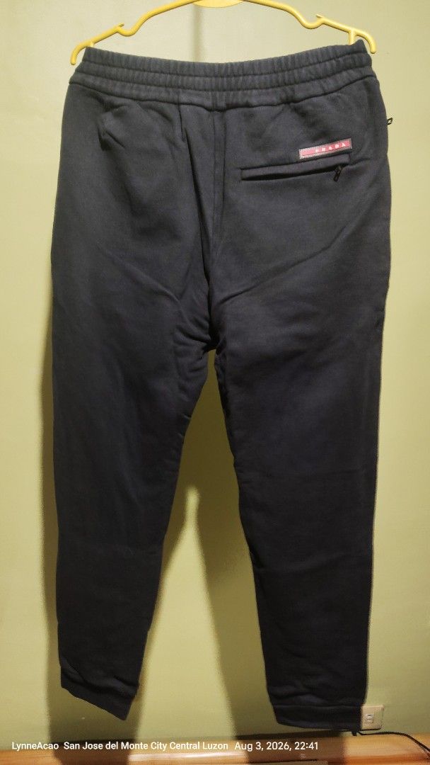 Prada Black Sweatpants Joggers Size XL (Category: Joggers) located in Manila. Submitted by rhobin.m08 (Listing ID 1453637549, Image 2). Description: - Brand: Prada - Color: Black - Size: XL - Features: Elastic waistband with drawstring, side zipper pocket, back pocket - Origin: Made in Romania - Ideal for: Lounging or casual wear.