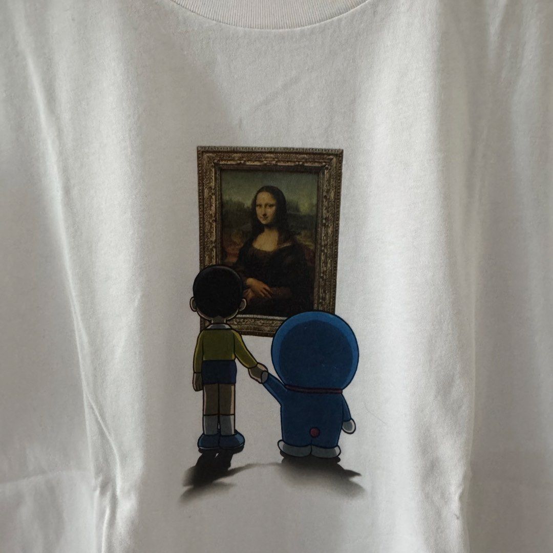 PRELOVED: Uniqlo Louvre Doraemon shirt (Category: Shirts) located in Valenzuela. Submitted by shop.spark.joy (Listing ID 1453700339, Image 2). Description: Used once L-25” W-19”.