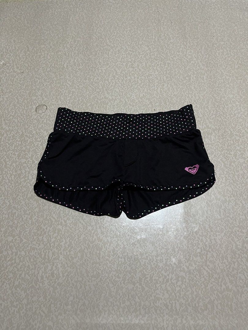 Roxy Black Polka Dot Athletic Shorts Size 10 (Category: Shorts) located in San Isidro, Leyte. Submitted by tigerxdx3580077 (Listing ID 1453699781, Image 1). Description: - Brand: Roxy - Color: Black - Size: 10 - Features: Polka dot waistband and trim, Roxy logo on left leg - Material: Nylon and Spandex blend - Ideal for: Sports and casual wear.