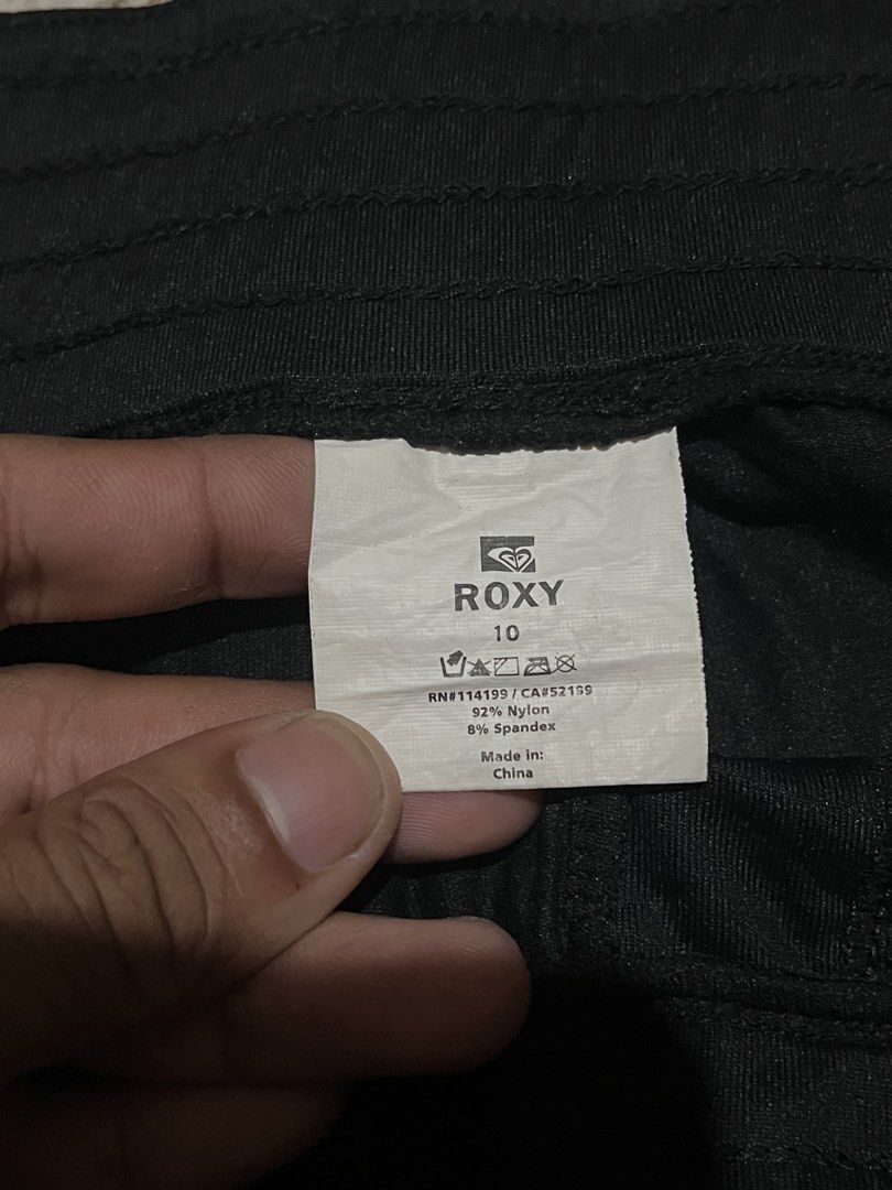 Roxy Black Polka Dot Athletic Shorts Size 10 (Category: Shorts) located in San Isidro, Leyte. Submitted by tigerxdx3580077 (Listing ID 1453699781, Image 3). Description: - Brand: Roxy - Color: Black - Size: 10 - Features: Polka dot waistband and trim, Roxy logo on left leg - Material: Nylon and Spandex blend - Ideal for: Sports and casual wear.