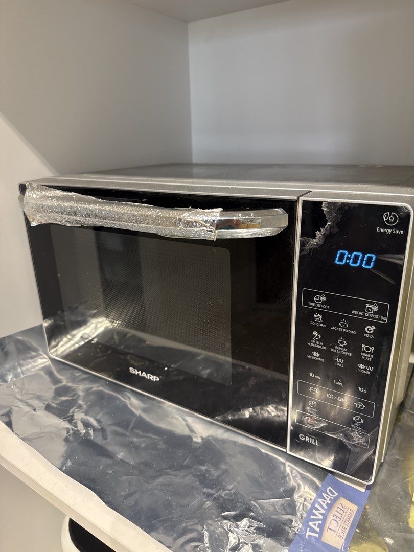 Sharp Microwave Oven with Grill Function (Category: Ovens & Toasters) located in Singapore. Submitted by aniksh (Listing ID 1453662830, Image 1). Description: - Sharp microwave. 10 months old. Used few times only. With box. Actual price 140 sgd - Sharp Microwave Oven - Grill Function Included - Digital Display for Time - Multiple Cooking Presets (Popcorn, Potato, Pizza, etc.) - User-Friendly Controls - Ideal for Quick Meals & Reheating - Moving o