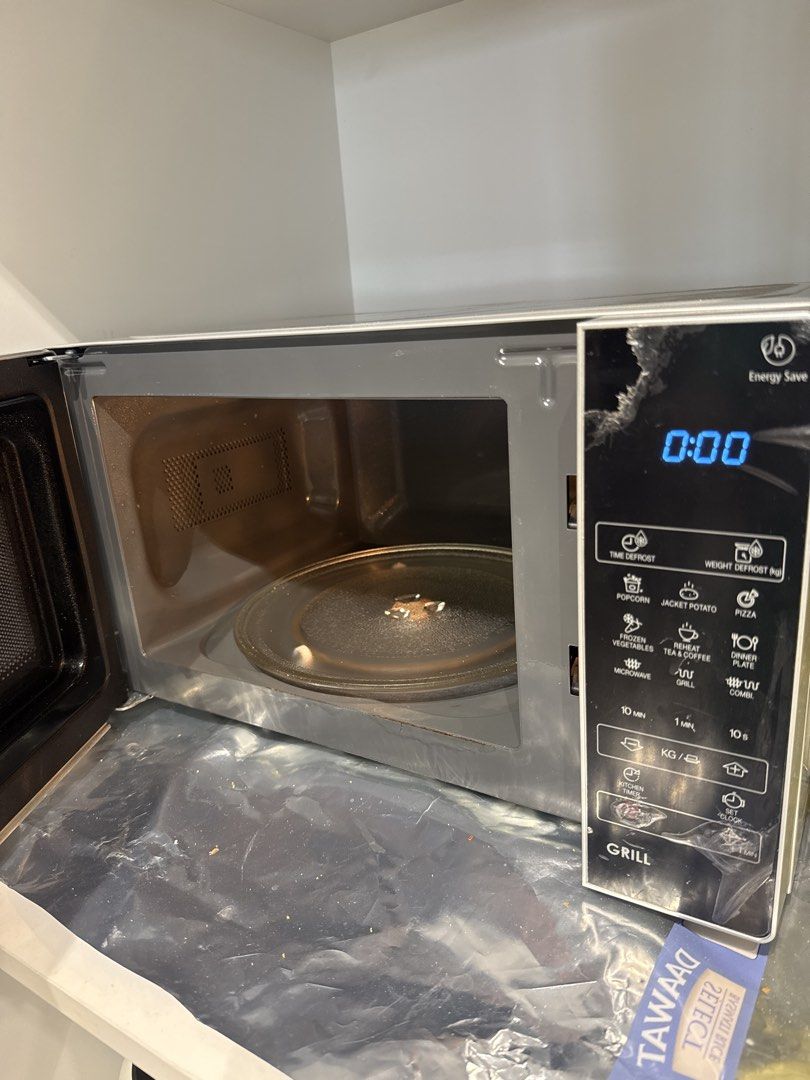 Sharp Microwave Oven with Grill Function (Category: Ovens & Toasters) located in Singapore. Submitted by aniksh (Listing ID 1453662830, Image 2). Description: - Sharp microwave. 10 months old. Used few times only. With box. Actual price 140 sgd - Sharp Microwave Oven - Grill Function Included - Digital Display for Time - Multiple Cooking Presets (Popcorn, Potato, Pizza, etc.) - User-Friendly Controls - Ideal for Quick Meals & Reheating - Moving o