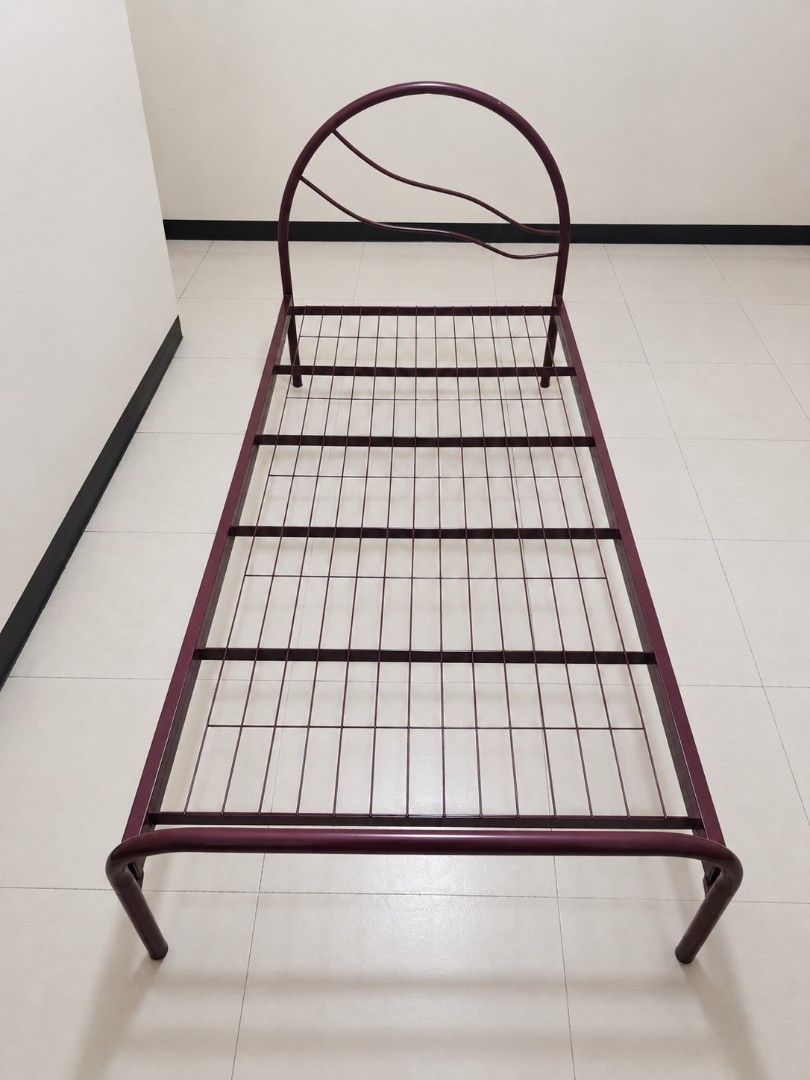 Single Bed Frame with Curved Headboard (Category: Bed Frames & Mattresses) located in Manila. Submitted by vastlion_cbbc9b (Listing ID 1453699546, Image 1). Description: - Deep red/maroon single metal bed frame - Simple curved headboard with decorative lines - Sturdy slatted metal base - Ready for a mattress - Ideal for a child's room or guest room.