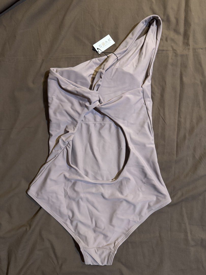 One piece Swimsuit (Category: Bikinis & Swimsuits) located in Las Pinas. Submitted by vrache (Listing ID 1453811969, Image 2). Description: - Brand new with tags attached - Stylish one-shoulder design - Flattering twisted front detail - Chic back cutout - Beautiful muted mauve/dusty rose color - Ideal for your next beach or pool outing.