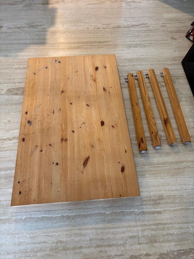 Solid Wooden Table (Category: Tables & Sets) located in Singapore. Submitted by chumsterandfins (Listing ID 1453646339, Image 1). Description: - solid Wooden table with natural grain and knots - 4 sturdy legs with pre-attached metal screws - 75x120x73cm - Perfect for small dining spaces - Simple and easy assembly - pickup from Newton .