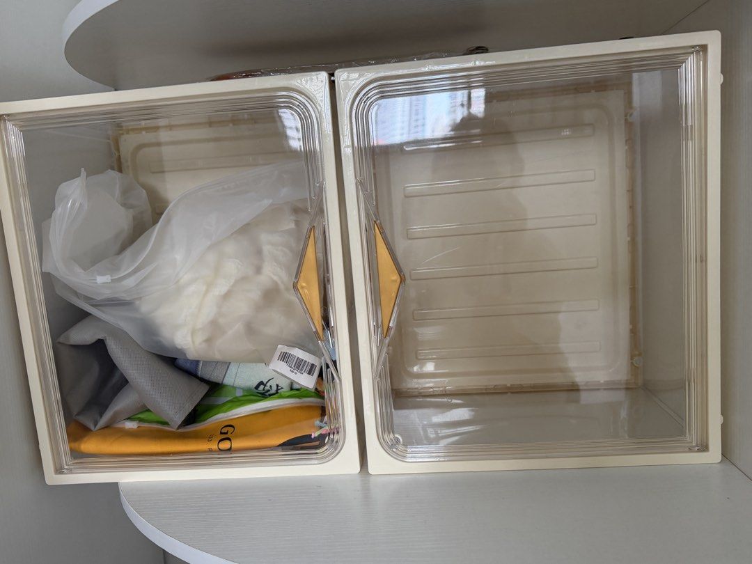 Stackable Storage Boxes with Clear Lids (Category: Storage Boxes & Baskets) located in Singapore. Submitted by thebluerose (Listing ID 1453697590, Image 1). Description: - 6 for $15 - Clear lids, cream-colored bases - One box is empty, the other contains items - Ideal for organizing closets and shelves - Stackable design for space-saving - Easy to see contents through clear lids.