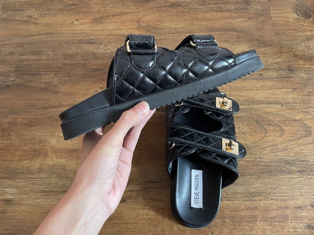 Steve Madden “Schmona-CN” Quilted Slide Sandals (Category: Flats & Sandals) located in Manila. Submitted by nextowner.zip (Listing ID 1453648200, Image 3). Description: - Stylish black Steve Madden slides - Quilted straps with elegant gold buckle details - Adjustable velcro straps for a customized, comfortable fit - Effortless slip-on design for convenience - Perfect for casual outings and everyday wear - Size : 7.5.