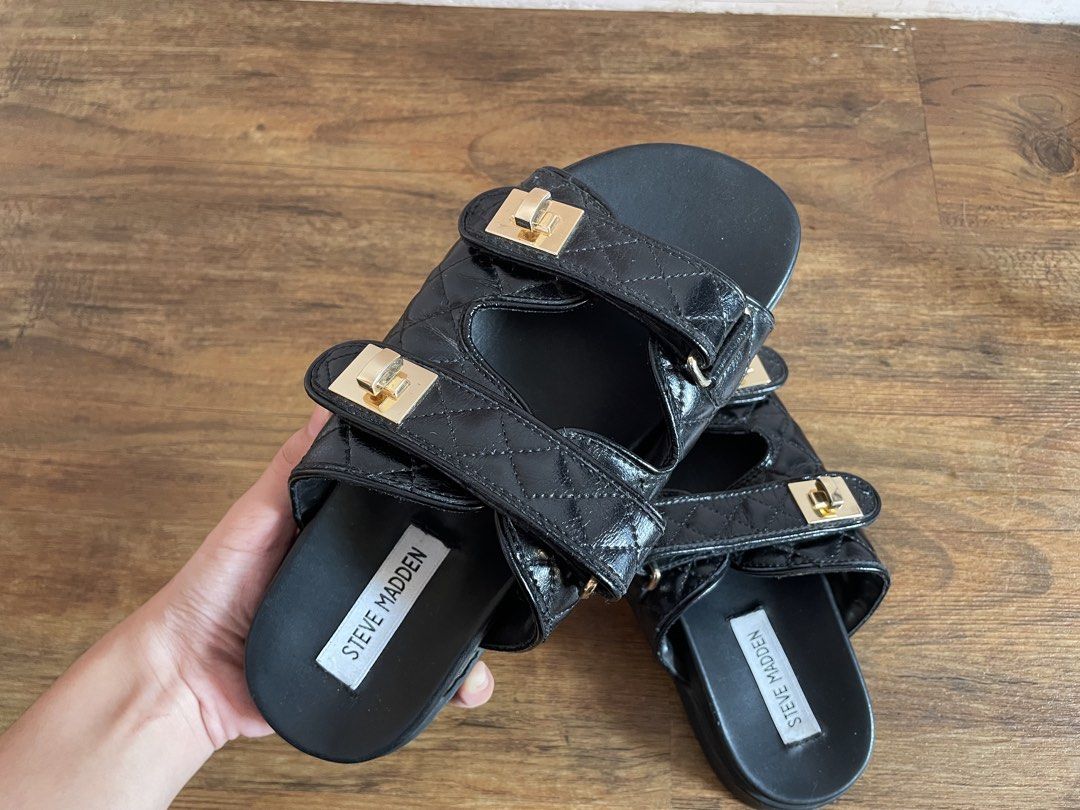 Steve Madden “Schmona-CN” Quilted Slide Sandals (Category: Flats & Sandals) located in Manila. Submitted by nextowner.zip (Listing ID 1453648200, Image 2). Description: - Stylish black Steve Madden slides - Quilted straps with elegant gold buckle details - Adjustable velcro straps for a customized, comfortable fit - Effortless slip-on design for convenience - Perfect for casual outings and everyday wear - Size : 7.5.