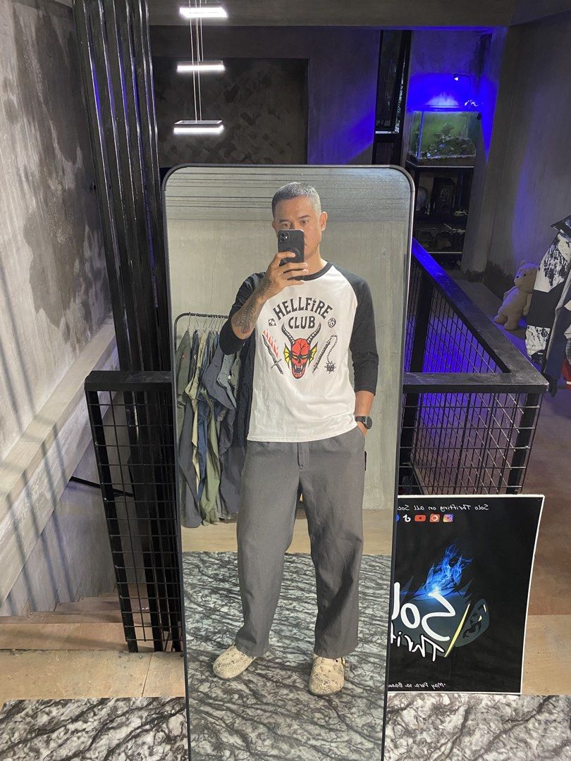 Stranger Things Hellfire Club Raglan Shirt (Category: Tshirts & Polo Shirts ) located in Solano. Submitted by solothrifting (Listing ID 1453810582, Image 2). Description: Stranger Things Hellfire Club Raglan Shirt Condition: 10/10 Deadstock Size on tag: M Length x Width: 28.5x20.5 Model: 5'10.