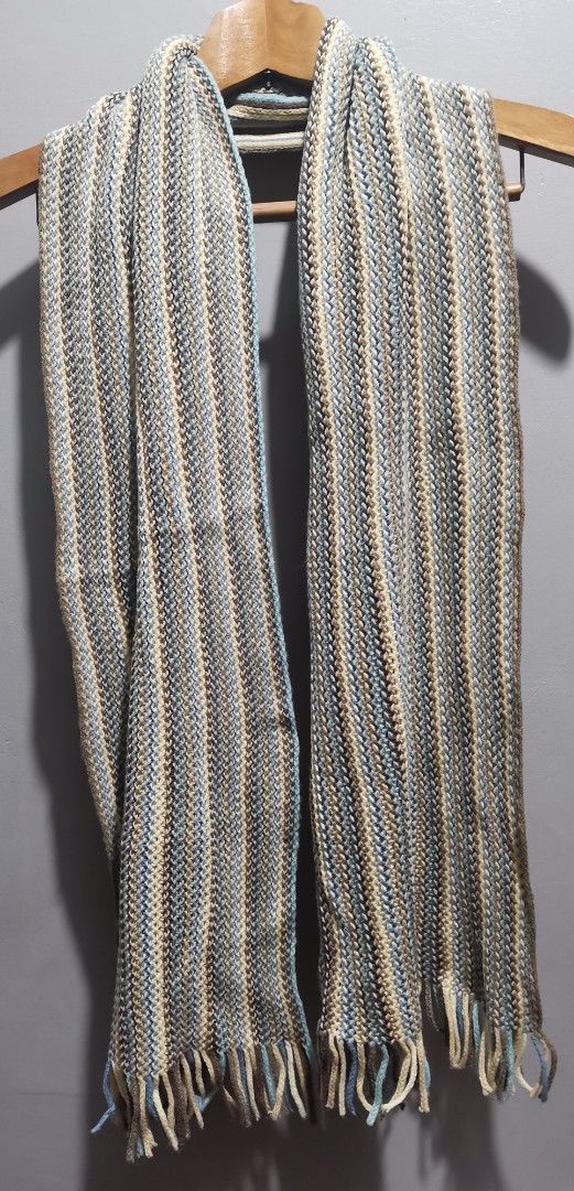Striped Knit Scarf with Fringe (Category: Scarves) located in Quezon City. Submitted by heybailey (Listing ID 1453693335, Image 1). Description: - Cozy knit scarf - Vertical stripes in cream, light blue, and brown - Fringe detailing at the ends - Adds warmth and style to any outfit - Approximate dimensions: [insert length here] long x [insert width here] wide - Ideal for cooler weather.