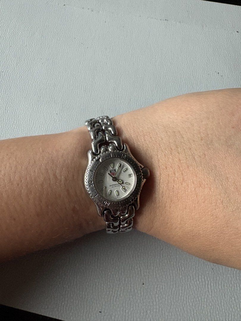 Tag Heuer Professional 200m Watch (Category: Luxury Watches) located in Manila. Submitted by kr_fashion_hub (Listing ID 1422116163, Image 1). Description: - Tag Heuer Professional 200m watch - White dial - Stainless steel band and case - Clasp markings: "TAG HEUER" and "ALL STAINLESS STEEL" - Back markings: "TAG HEUER", "200 METERS TESTED", and "SWISS MADE".