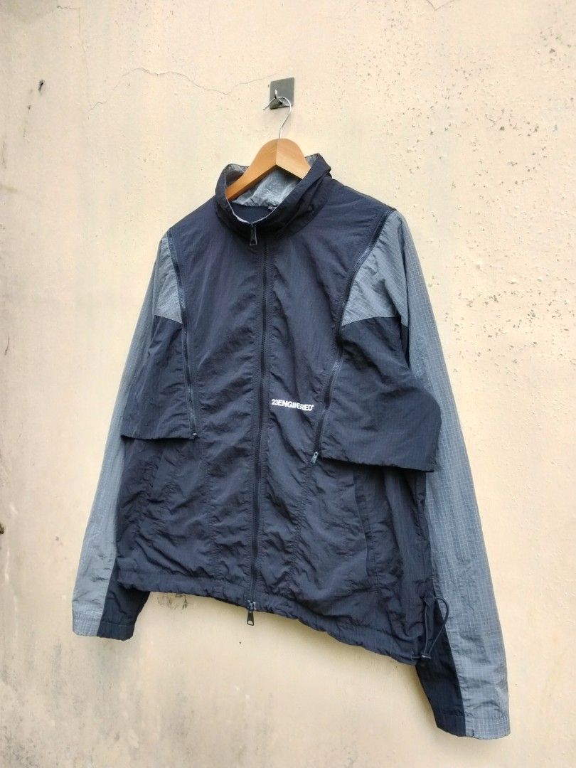 The black and iron grey Jordan 23 Engineered Woven Jacket (Category: Coats, Jackets and Outerwear) located in Quezon. Submitted by thrift.21 (Listing ID 1453698175, Image 2). Description: - The black and iron grey Jordan 23 Engineered Woven Jacket - Size: XXL - Dimes: 23x28 - Color: Black and Grey - Material: Lightweight, perfect for casual wear or sports - Features: Zip-up front, pockets - Origin: Made in China - The black and iron grey Jordan 2