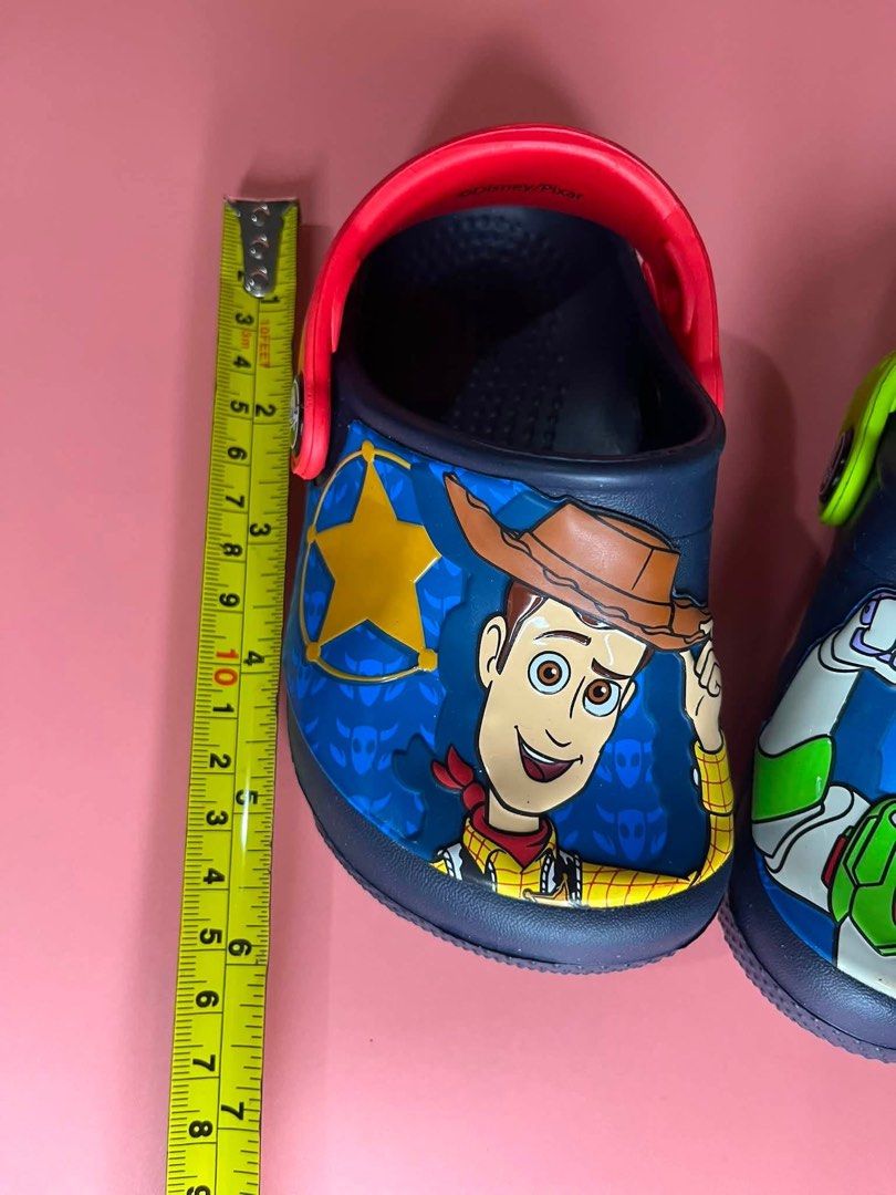Toy Story Crocs Fun Lab Buzz and Woody Clogs (Category: Babies & Kids Fashion) located in Caloocan City. Submitted by snapshop_ph (Listing ID 1453701439, Image 3). Description: C6 size.