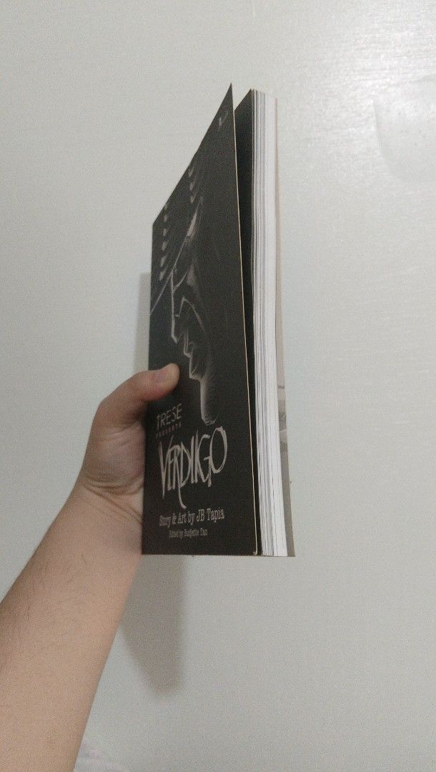 Trese Presents: Verdugo by JB Tapia (Category: Storybooks) located in Quezon City. Submitted by cclazo1029 (Listing ID 1453659219, Image 2). Description: RFS: decluttering 📖📚 Like new, no writings, no highlights, in very good condition. Has a few tiny spot stains on the top edge of the book Signed copy with my name (CJ) on it. .