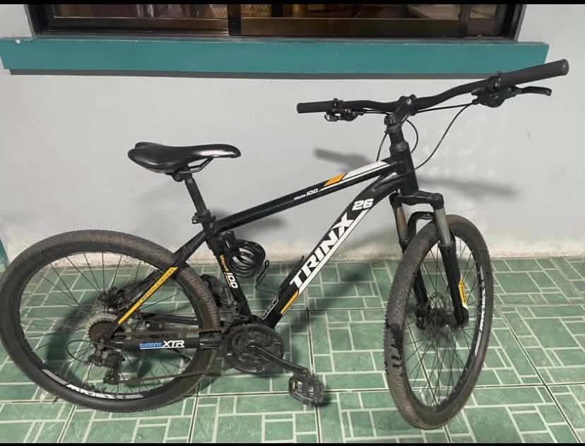 TRINX Mountain Bike 26" - Black (Category: Bicycles) located in Trece Martires City. Submitted by starific (Listing ID 1453678233, Image 2). Description: - TRINX Mountain Bike - 26-inch wheels - Black frame with yellow and white accents - Comes with a lock - Perfect for trails and city commuting - Ready for your next adventure!.