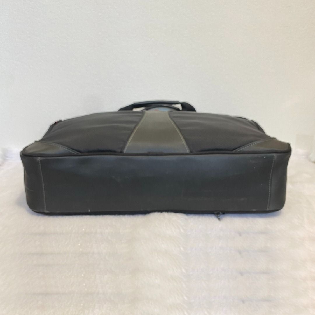 Tumi Tech Black Ballistic Nylon Laptop Messenger Documents Bag (Category: Briefcases) located in Cebu City. Submitted by posh_avenue888 (Listing ID 1453793973, Image 3). Description: In very good condition with normal signs of wear (damaged zipped pulls - please see photos). This bag has multiple compartments for your laptop and other essentials. Made of durable ballistic nylon. 100% Authentic or your money back!!! Measurements (estimated-taken f