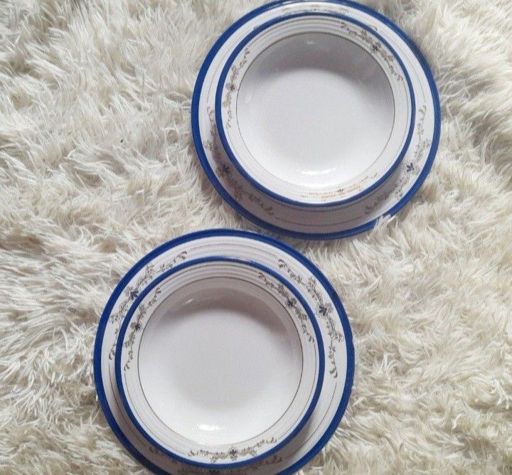 Tupperware Brands Melamine Plates Set of 12 (Category: Dinnerware & Cutlery) located in Quezon City. Submitted by kyleenscloset (Listing ID 1453645558, Image 2). Description: ♡Set of 12 Tupperware Select Line dinner plates and bowl ♡10" plates (6pcs) ♡300ml capacity deep plate/bowls (6pcs) ♡White base with blue rim ♡Stackable design for convenient storage.
