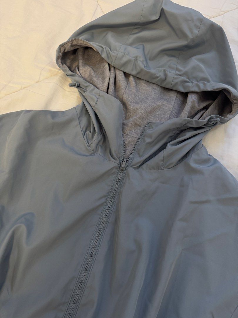 UNIQLO reversible parka jacket (Category: Coats, Jackets and Outerwear) located in Butuan. Submitted by notcwp (Listing ID 1453741721, Image 3). Description: - Light blue hooded jacket - Full zip front closure - Two side pockets - Elasticated cuffs and hem - Ideal for windy days or light rain - Lightweight and packable.