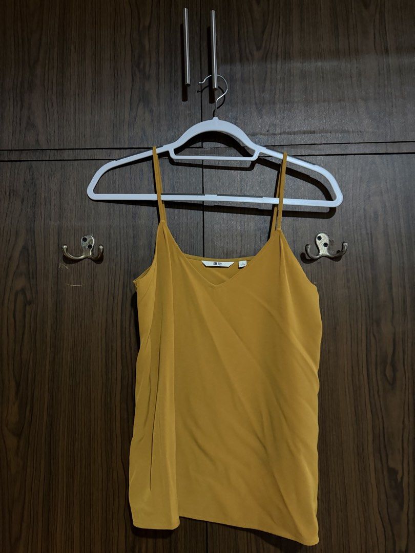 Uniqlo V-Line Camisole (Category: Sleeveless) located in Makati City. Submitted by saladstuff (Listing ID 1453739192, Image 3). Description: Authentic UNIQLO V-Line Camisole • used once •colors: LIGHT BLUE, MUSTARD, BURGUNDY • size SMALL Take all 3pcs for ₱500 ₱180 each.