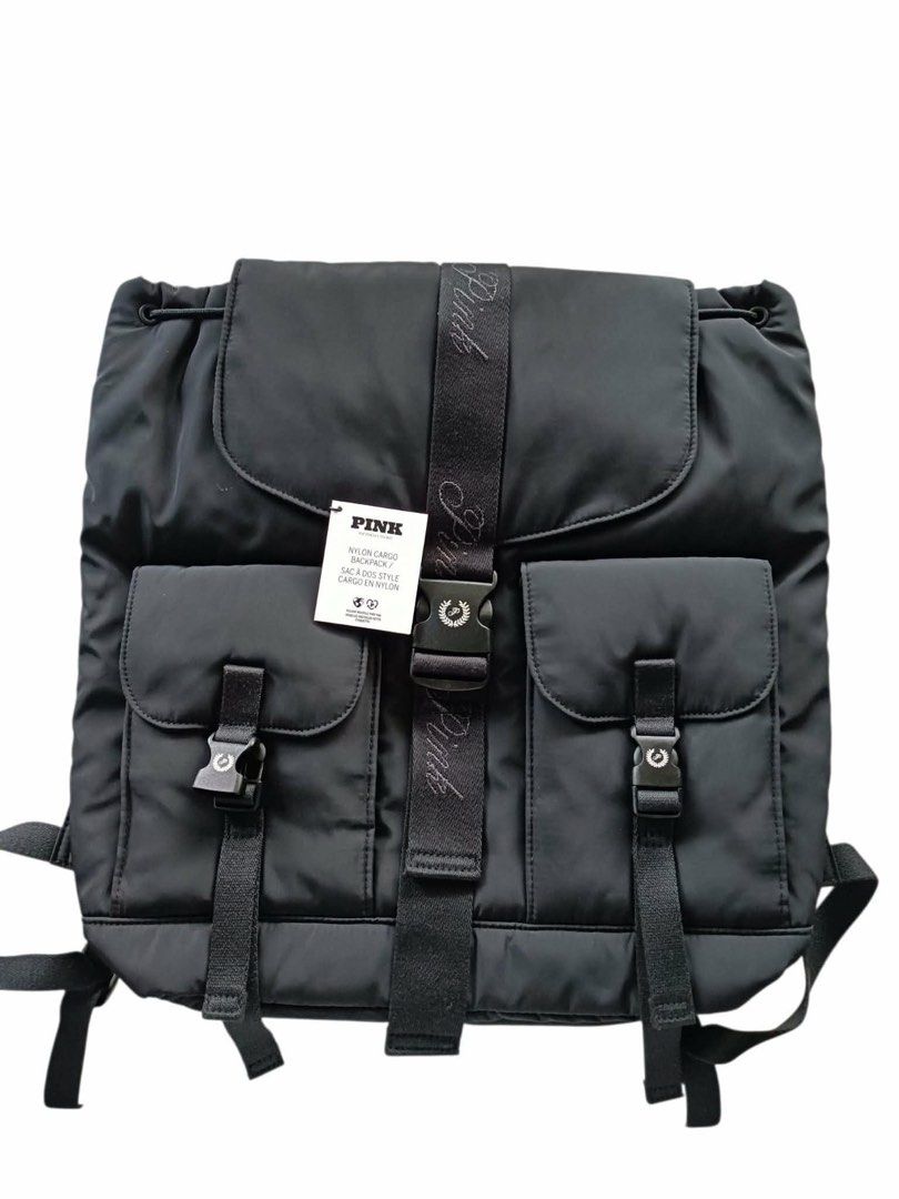 Victoria's Secret Pink Nylon Cargo Backpack Black (Category: Backpacks) located in Angeles City. Submitted by safe.simpledesign (Listing ID 1453671317, Image 1). Description: - Black Victoria's Secret Pink nylon cargo backpack - Secure drawstring closure with an additional buckle strap - Two front pockets with buckle closures for easy access - Internal zip pocket for valuables - Adjustable shoulder straps for comfortable carrying - Ideal for ever