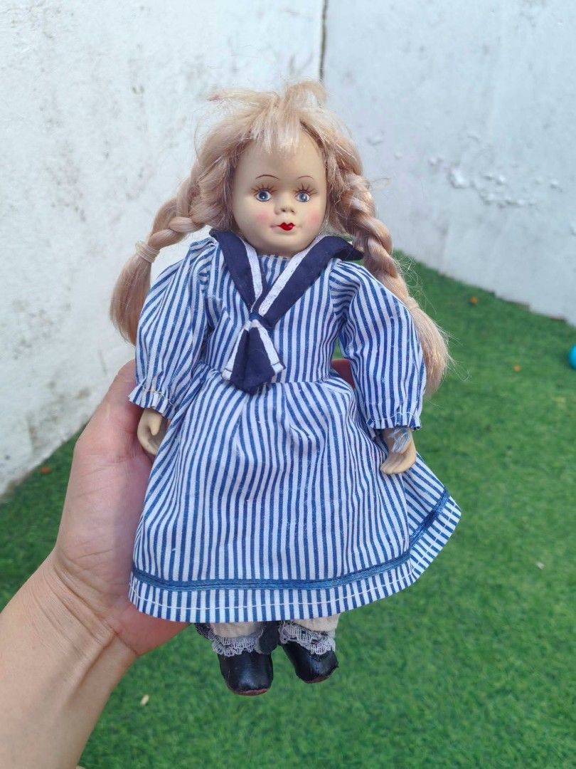 Vintage Porcelain Sailor Doll (Category: Vintage Collectibles) located in Cebu City. Submitted by dudes_villanueva (Listing ID 1453744614, Image 1). Description: Vintage Porcelain Sailor Doll 📌 features a fine bisque/porcelain head and matching extremities paired with a soft stuffed cloth body 📌 It wears a classic nautical navy-and-white vertically striped dress paired with a navy sailor collar and a matching front-tied neck scarf. 📌 These spe