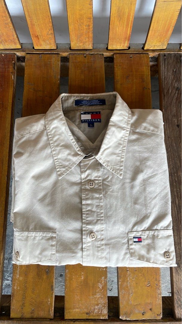 Vintage Tommy Hilfiger cream short-sleeve button-down (Category: Formal Shirts) located in Marikina City. Submitted by 4af966271c192b2f74291393ce6f74 (Listing ID 1453687038, Image 2). Description: Vintage Tommy Hilfiger cream short-sleeve button-down utility shirt featuring dual chest flap pockets and the brand’s classic embroidered flag logo on the left pocket. .