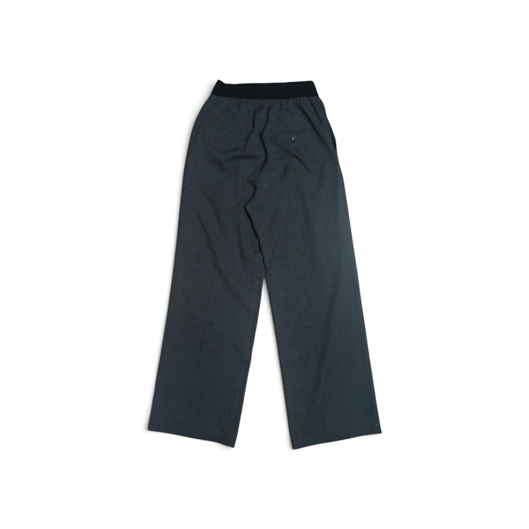 WE11DONE Logo Trousers - Charcoal (Category: Trousers) located in Las Pinas. Submitted by rcp123 (Listing ID 1453785971, Image 2). Description: - Brand: WE11DONE - Color: Charcoal Grey - Fit: Wide Leg - Features: Elasticated waistband, signature logo on left leg - Style: Versatile for casual or smart casual outfits - Authenticity: Guaranteed, verify with QR code on tag.