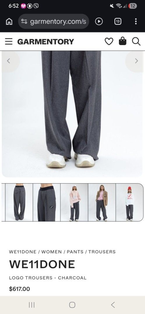 WE11DONE Logo Trousers - Charcoal (Category: Trousers) located in Las Pinas. Submitted by rcp123 (Listing ID 1453785971, Image 3). Description: - Brand: WE11DONE - Color: Charcoal Grey - Fit: Wide Leg - Features: Elasticated waistband, signature logo on left leg - Style: Versatile for casual or smart casual outfits - Authenticity: Guaranteed, verify with QR code on tag.