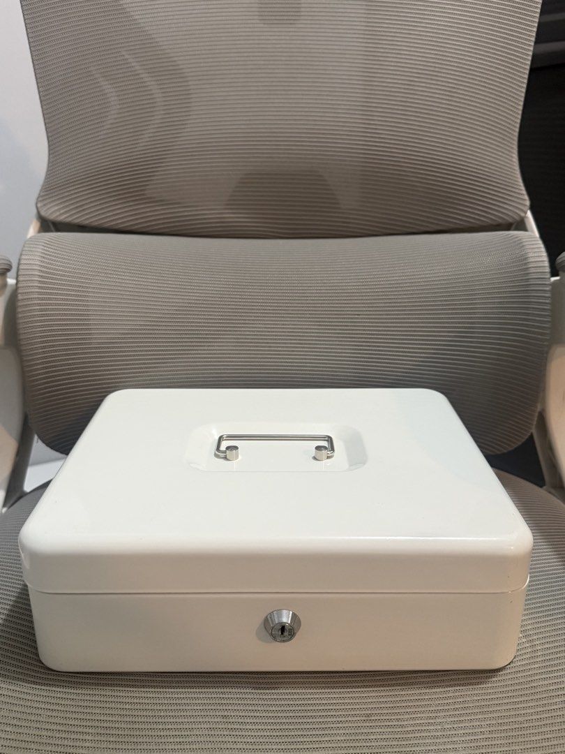 White 30cm Cash Box with Drawer and Lock (Category: Storage Boxes & Baskets) located in Batangas. Submitted by melocollects (Listing ID 1453794786, Image 2). Description: - 30cm White Cash Box - issue: no keys❌ - Built-in drawer for organizing bills and coins - Includes lock and key for security - Portable and convenient for cash storage - Ideal for home or small business use - loc: lipa batangas.