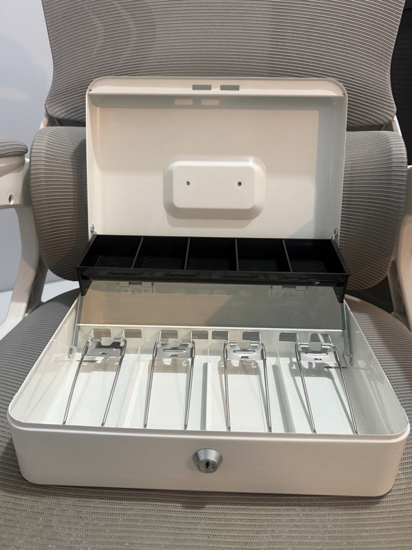 White 30cm Cash Box with Drawer and Lock (Category: Storage Boxes & Baskets) located in Batangas. Submitted by melocollects (Listing ID 1453794786, Image 3). Description: - 30cm White Cash Box - issue: no keys❌ - Built-in drawer for organizing bills and coins - Includes lock and key for security - Portable and convenient for cash storage - Ideal for home or small business use - loc: lipa batangas.