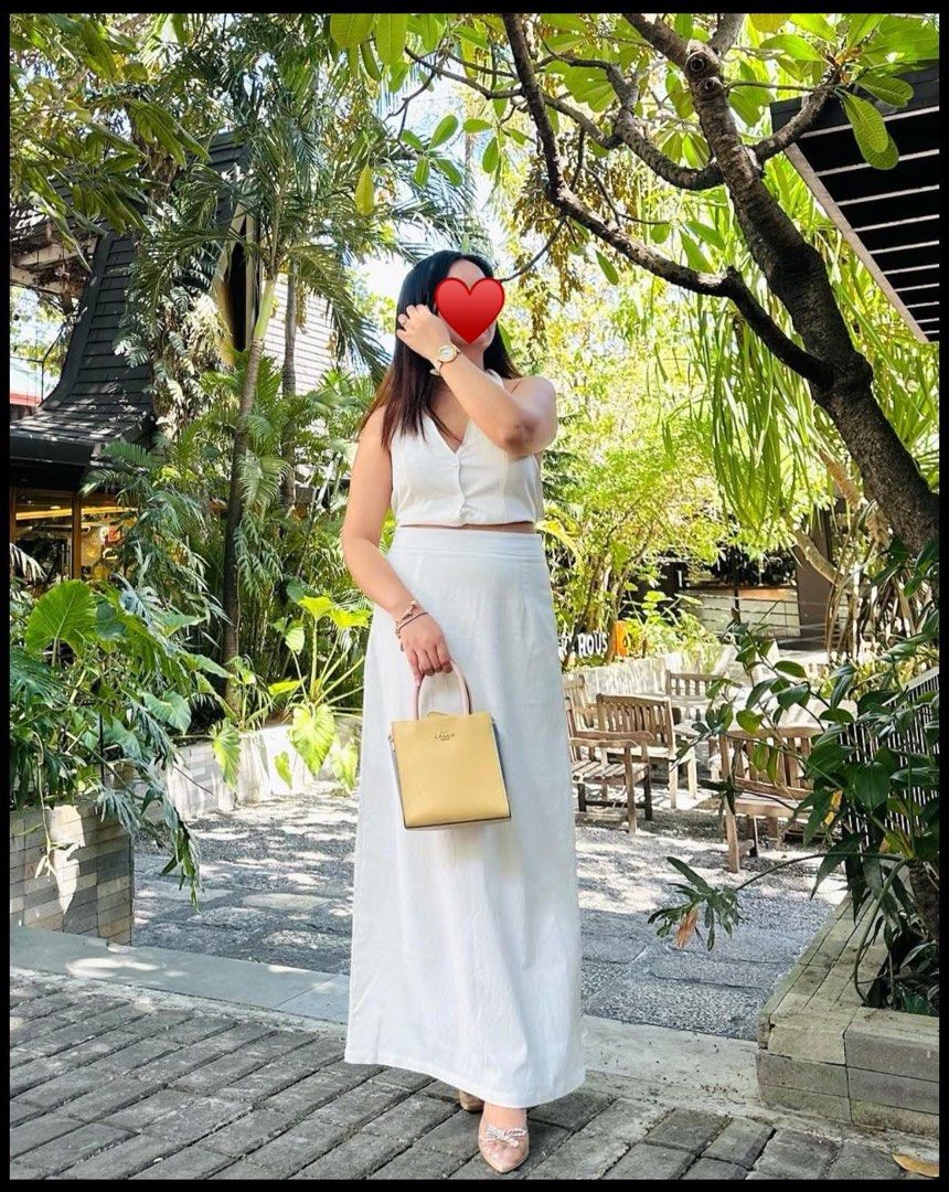 White Linen Top and Maxi Skirt Set (Category: Sets or Coordinates) located in San Jose del Monte. Submitted by eniger0693 (Listing ID 1453734322, Image 1). Description: - White linen two-piece set - Sleeveless crop top with button details - High-waisted maxi skirt - Comfortable and breathable fabric - Ideal for casual outings or beach days - Versatile: pairs well with sandals or heels.