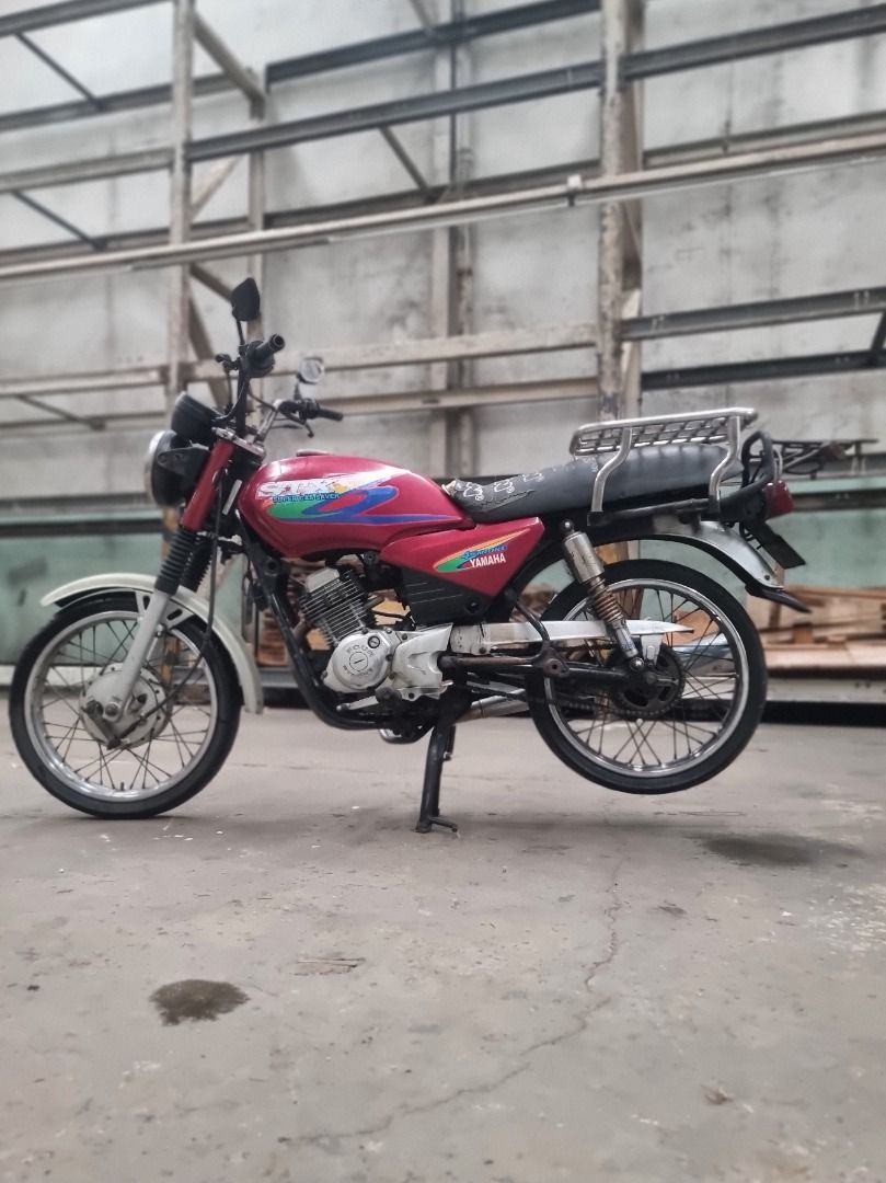 YAMAHA STX 125cc 2003 Model (Category: Motorbikes for Sale) located in Quezon City. Submitted by kontaktpoint (Listing ID 1453723743, Image 2). Description: YAMAHA STX 125cc 2003 Model Color: Red Company Owned Service Vehicle, Completer LTO Documents ₱15,000.00 or Best Offer. Contact Person: Ms. Emily Contact Number: 09772591198.